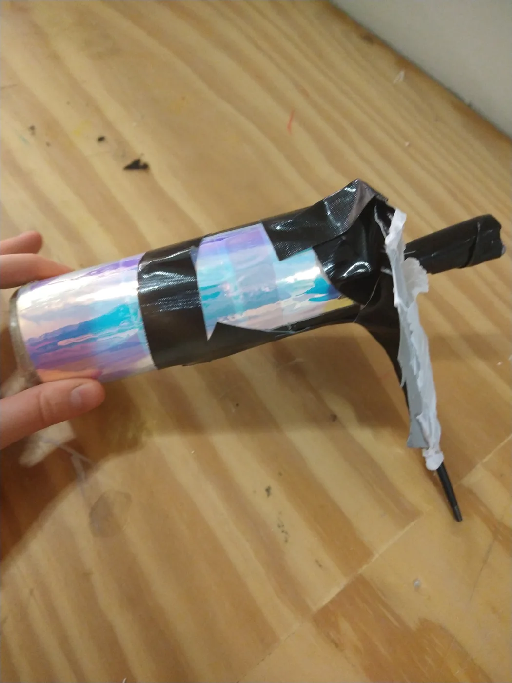 The handmade kaleidoscope built from iridescent film and tape