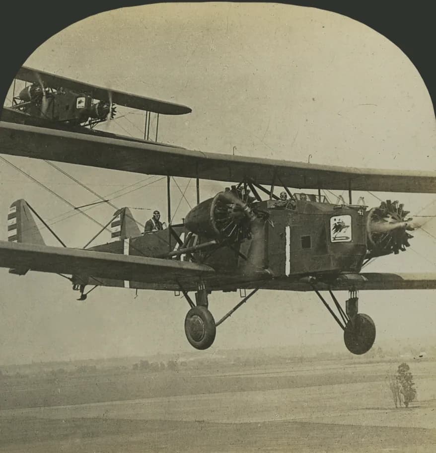 Retouched stereograph of 1920s Army biplanes in flight